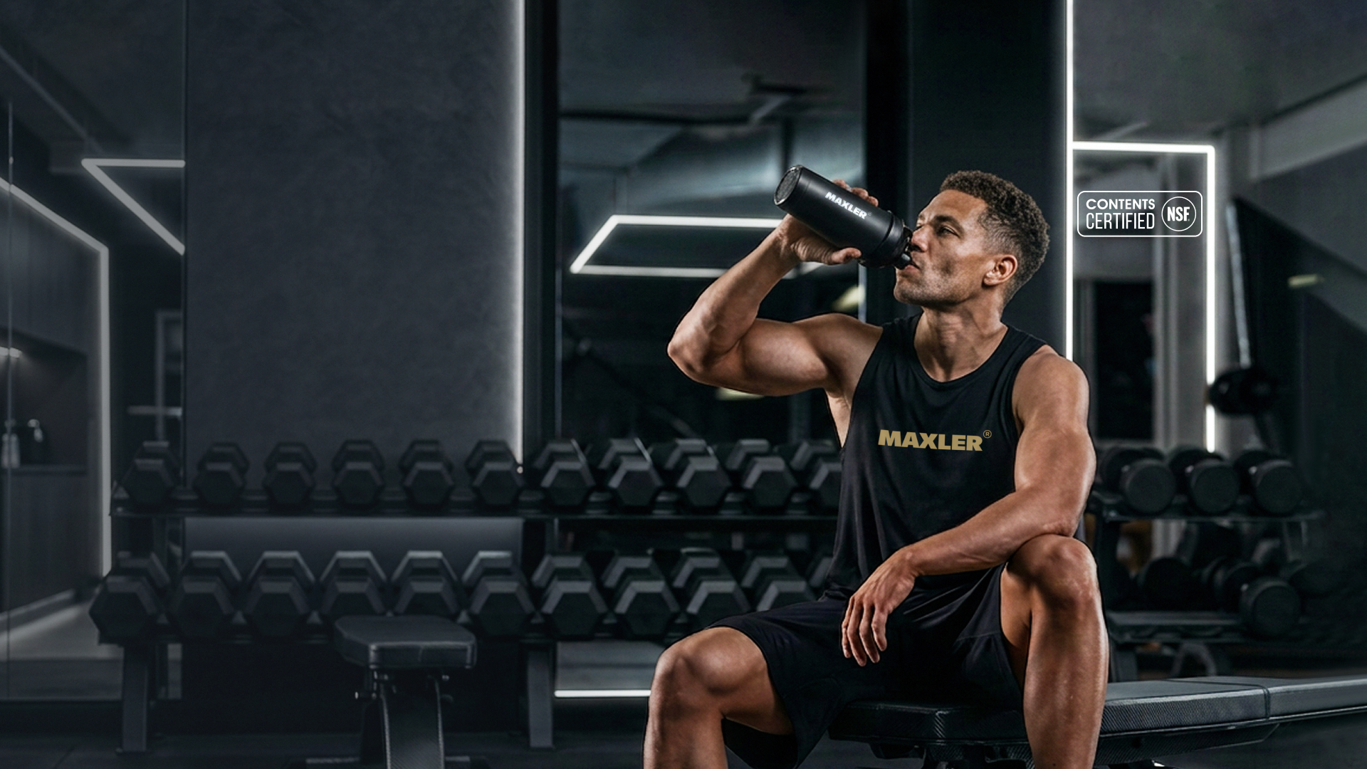 Maxler athlete drinking from a shaker in a gym with NSF Contents Certified logo
