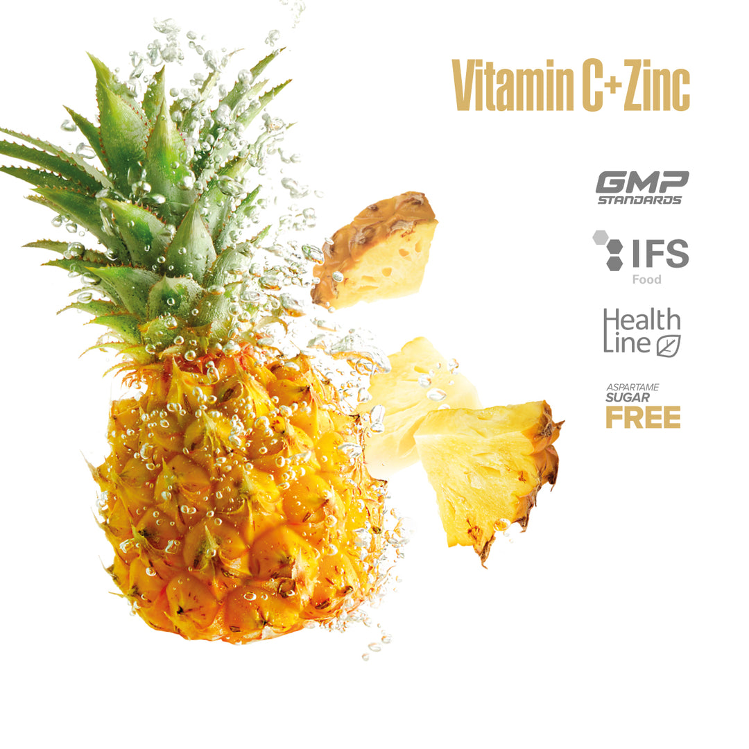 Pineapple with a slice on a white background, featuring 'Vitamin C + Zinc' text and certification logos.